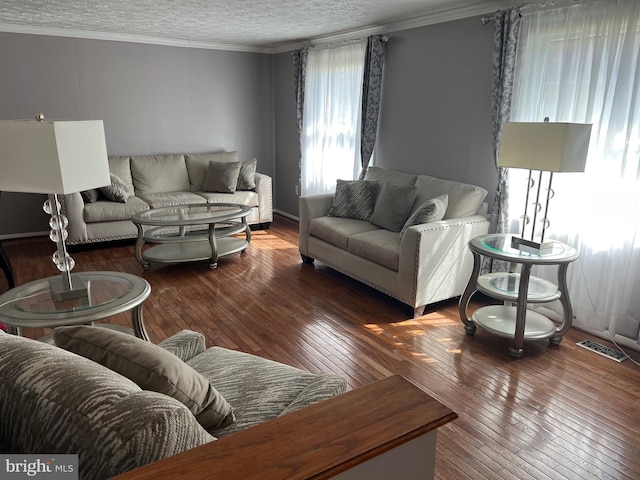 10808 Timberline Dr, Upper Marlboro, MD 20772 - living room featuring hardwood / wood-style floors, a textured ceiling, visible vents, and crown molding