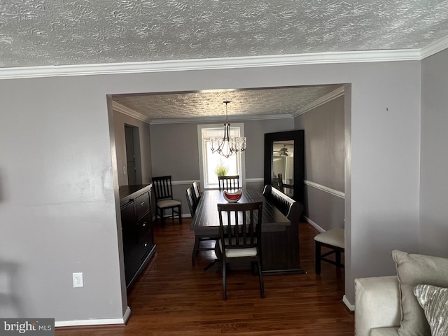10808 Timberline Dr, Upper Marlboro, MD 20772 - dining space featuring a textured ceiling, ornamental molding, an inviting chandelier, and dark wood finished floors