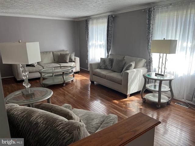 10808 Timberline Dr, Upper Marlboro, MD 20772 - living area featuring hardwood / wood-style floors, ornamental molding, and visible vents
