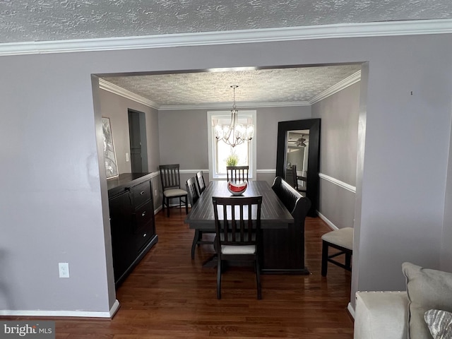 10808 Timberline Dr, Upper Marlboro, MD 20772 - dining room with a textured ceiling, dark wood-style floors, an inviting chandelier, and crown molding