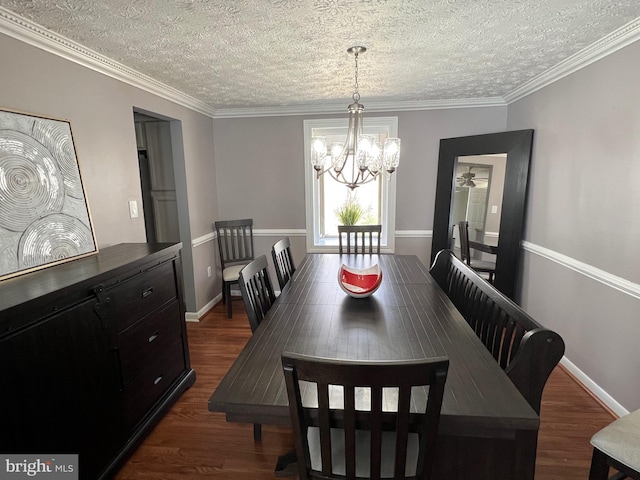 10808 Timberline Dr, Upper Marlboro, MD 20772 - dining space with dark wood finished floors, baseboards, a notable chandelier, and a textured ceiling