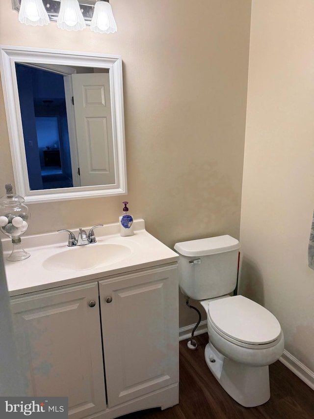 2440 Blue Spring Ct Unit 301, Odenton, MD 21113 - half bathroom with toilet, vanity, wood finished floors, and baseboards