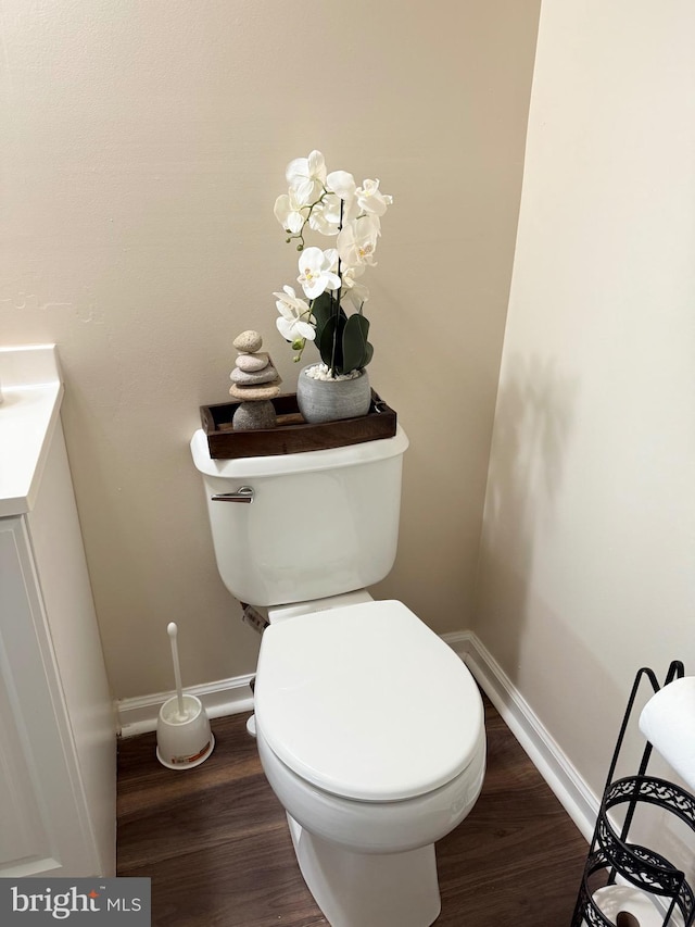 2440 Blue Spring Ct Unit 301, Odenton, MD 21113 - half bathroom with baseboards, wood finished floors, toilet, and vanity
