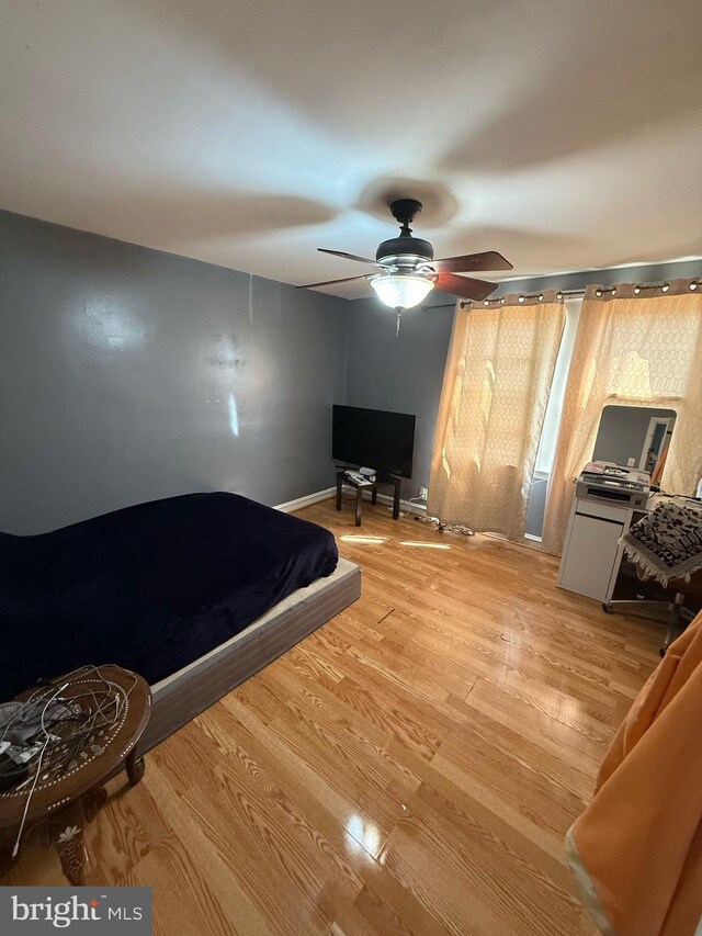 6016 Belden St, Philadelphia, PA 19149 - bedroom with baseboards, light wood-style floors, and ceiling fan