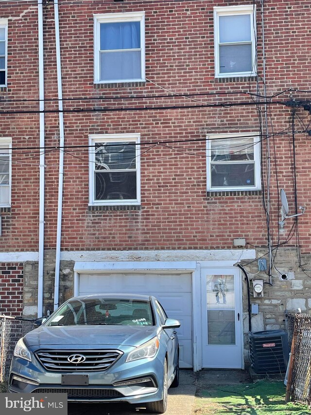 6016 Belden St, Philadelphia, PA 19149 - view of home's exterior with brick siding and a garage