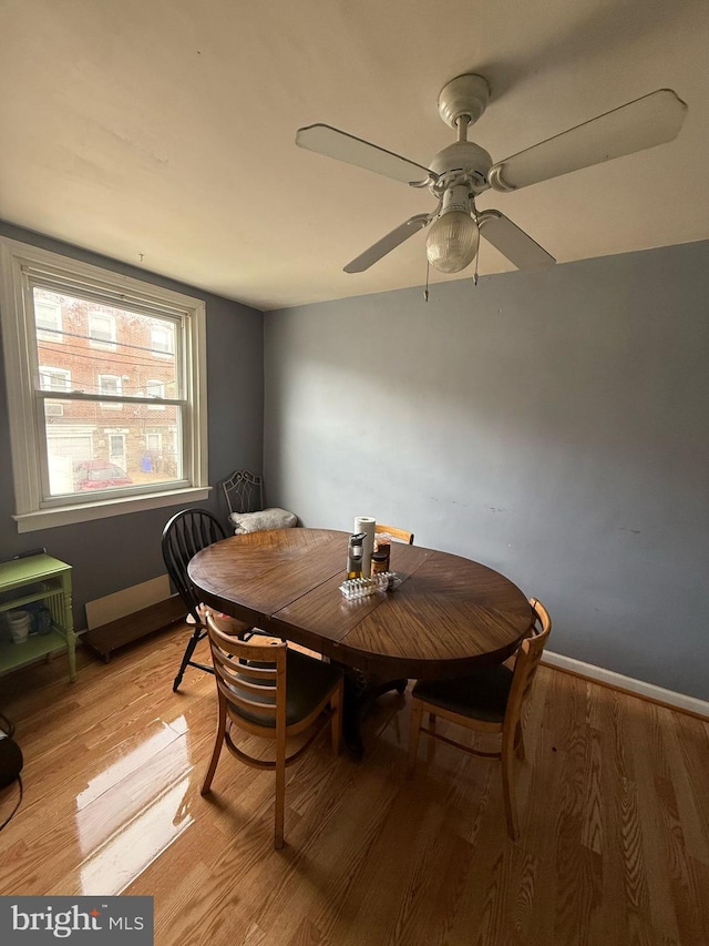 6016 Belden St, Philadelphia, PA 19149 - dining space with baseboards, light wood-style floors, and a ceiling fan