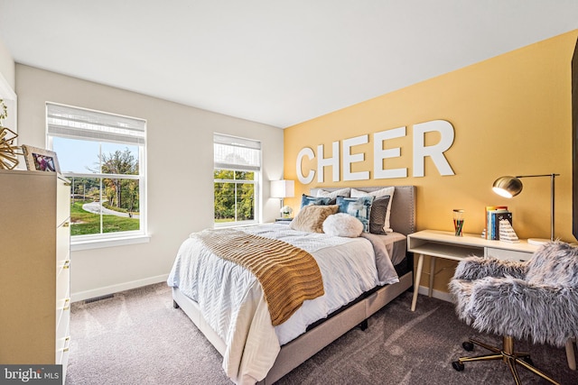 bedroom featuring baseboards, carpet floors, and visible vents