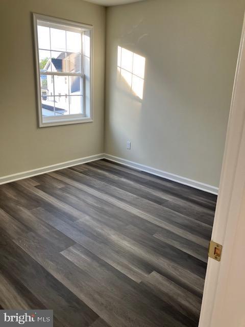 113 Heulings Ave, Riverside, NJ 08075 - empty room featuring baseboards and dark wood-type flooring
