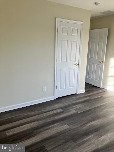 113 Heulings Ave, Riverside, NJ 08075 - unfurnished bedroom featuring baseboards and dark wood-style floors
