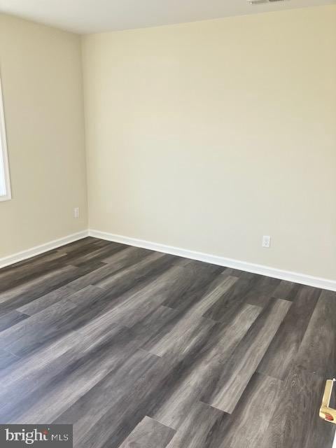 113 Heulings Ave, Riverside, NJ 08075 - empty room featuring visible vents, baseboards, and dark wood-style floors