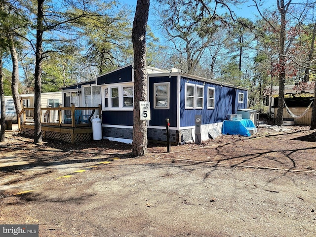 view of side of property featuring a deck