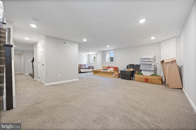 below grade area with recessed lighting, stairway, visible vents, and carpet floors