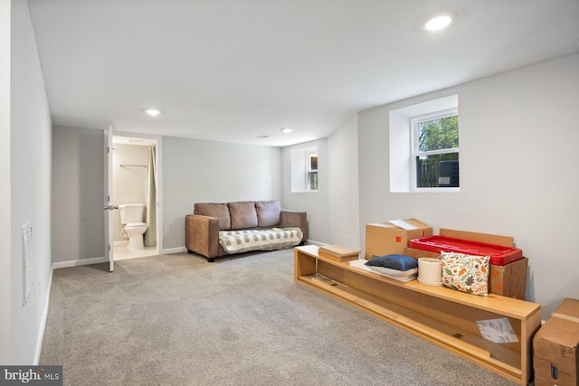 living room with recessed lighting, carpet flooring, and baseboards