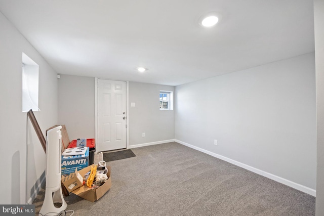 below grade area with carpet flooring, baseboards, and recessed lighting