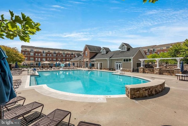 community pool featuring a patio area