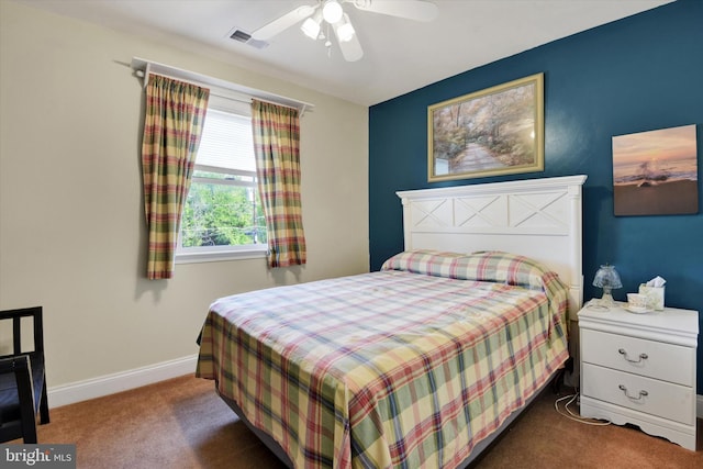 carpeted bedroom featuring visible vents, a ceiling fan, and baseboards