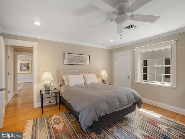 bedroom featuring ornamental molding, recessed lighting, light wood-style flooring, and visible vents