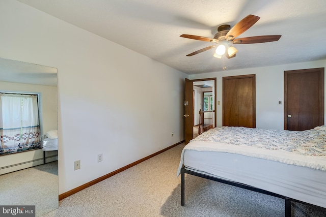 5605 Chapmans Landing Rd, Indian Head, MD 20640 - bedroom with light colored carpet, multiple windows, baseboard heating, and a ceiling fan