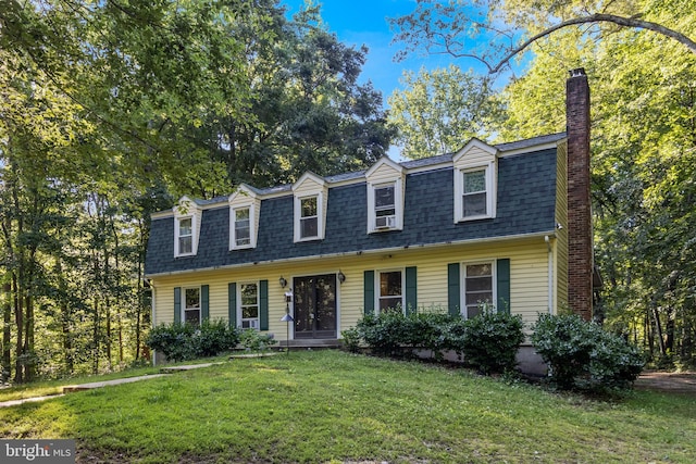 5605 Chapmans Landing Rd, Indian Head, MD 20640 - view of front of home with a chimney, a front lawn, and a shingled roof