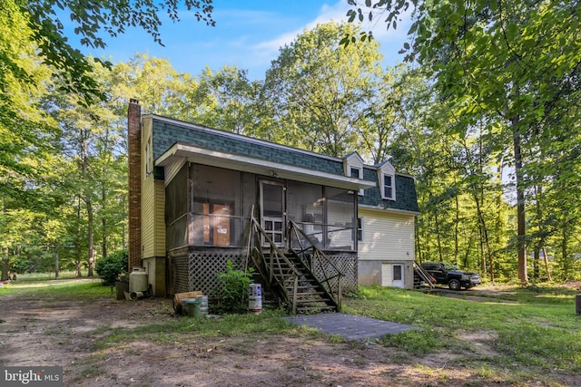 5605 Chapmans Landing Rd, Indian Head, MD 20640 - view of front of property with a shingled roof, a sunroom, a chimney, and stairway