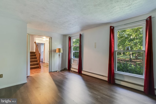 5605 Chapmans Landing Rd, Indian Head, MD 20640 - spare room featuring healthy amount of natural light, stairs, wood finished floors, and a textured ceiling