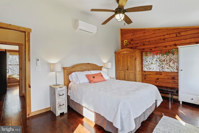 bedroom featuring baseboards, a wall mounted air conditioner, dark wood finished floors, wooden walls, and ceiling fan