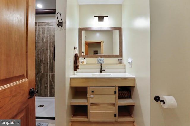 full bath featuring a sink and a stall shower