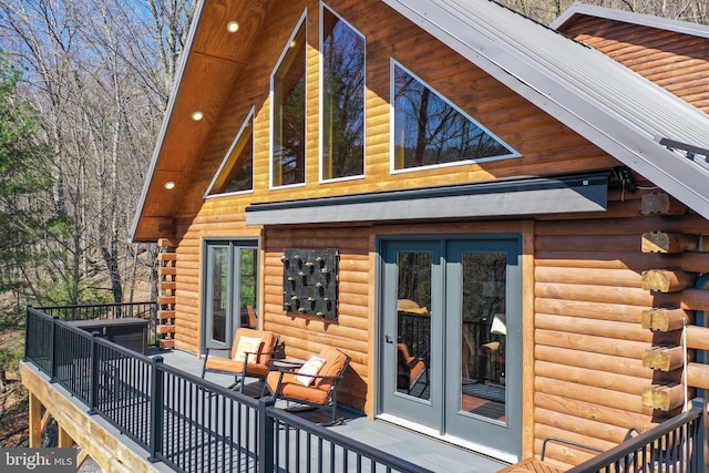 back of house with french doors and log exterior