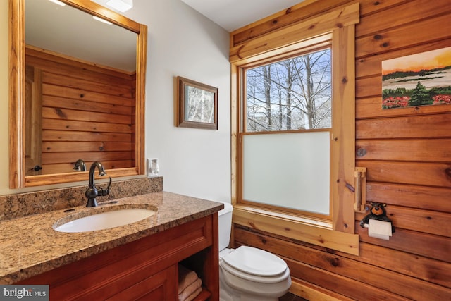 bathroom featuring toilet and vanity