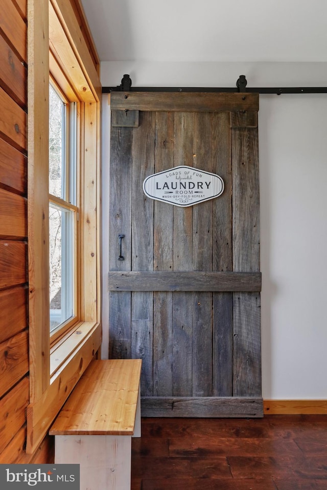 interior details featuring wood finished floors and baseboards