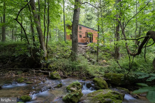 exterior space with a forest view