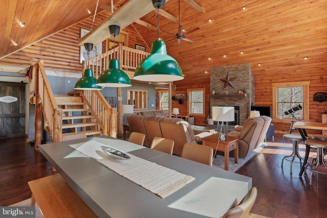 dining area with high vaulted ceiling, stairs, hardwood / wood-style flooring, and wood ceiling