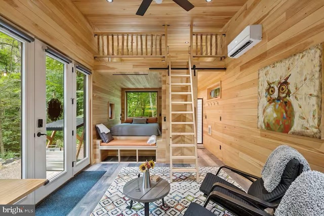 interior space featuring french doors and a wall unit AC