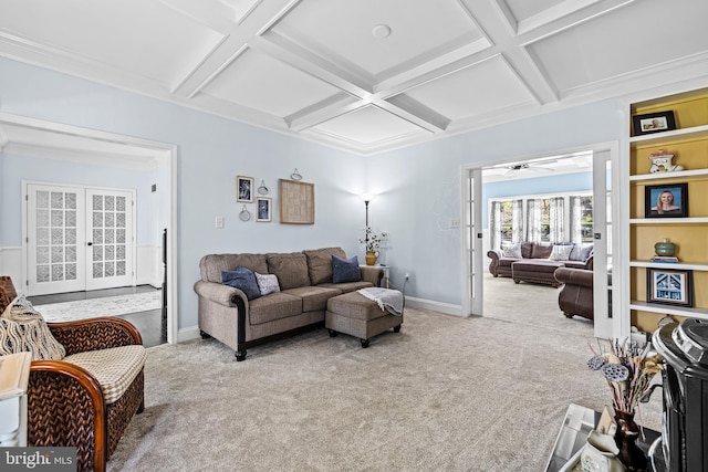 carpeted living room with baseboards, ceiling fan, beamed ceiling, french doors, and coffered ceiling
