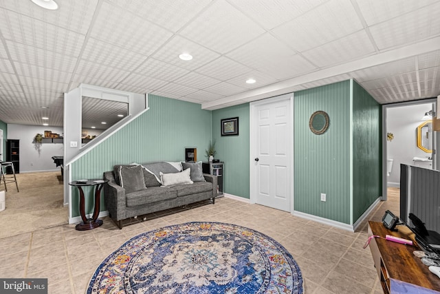 living room featuring tile patterned floors, recessed lighting, and baseboards