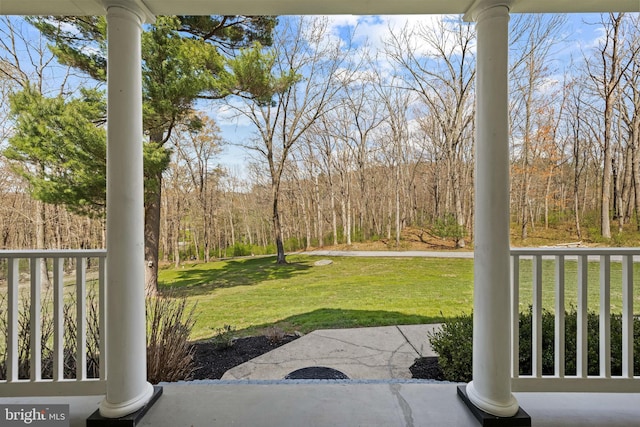 view of yard featuring covered porch