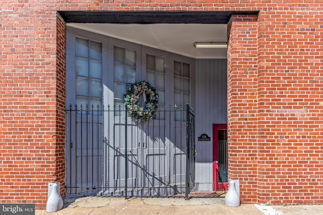 1516 Lancaster St, Baltimore, MD 21231 - view of exterior entry featuring brick siding and a gate