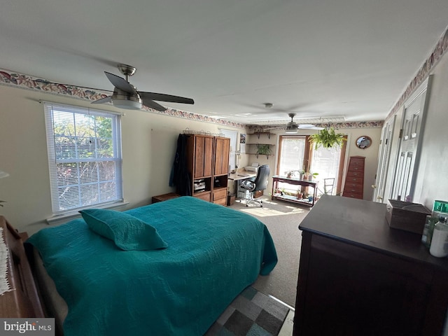 bedroom with ceiling fan and carpet floors