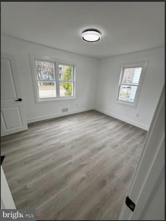 51 S Pine Ave, Maple Shade, NJ 08052 - spare room with baseboards, visible vents, and wood finished floors