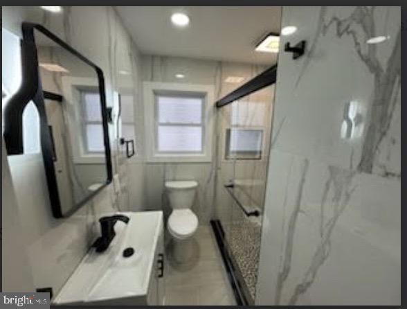 51 S Pine Ave, Maple Shade, NJ 08052 - full bathroom with toilet, vanity, and a marble finish shower