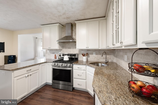 11809 Old Drovers Way, Rockville, MD 20852 - kitchen with stainless steel gas range, wall chimney exhaust hood, a peninsula, a sink, and white cabinets