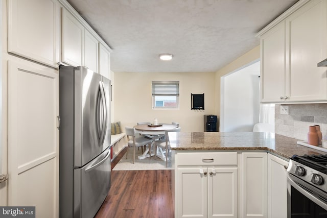 11809 Old Drovers Way, Rockville, MD 20852 - kitchen with stainless steel appliances, a peninsula, decorative backsplash, and white cabinets
