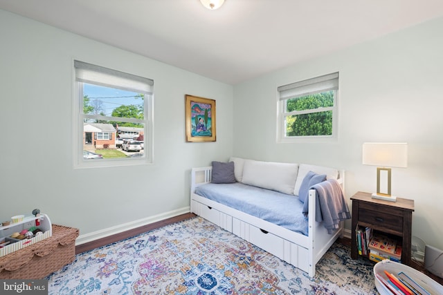 11809 Old Drovers Way, Rockville, MD 20852 - bedroom with multiple windows, baseboards, and wood finished floors