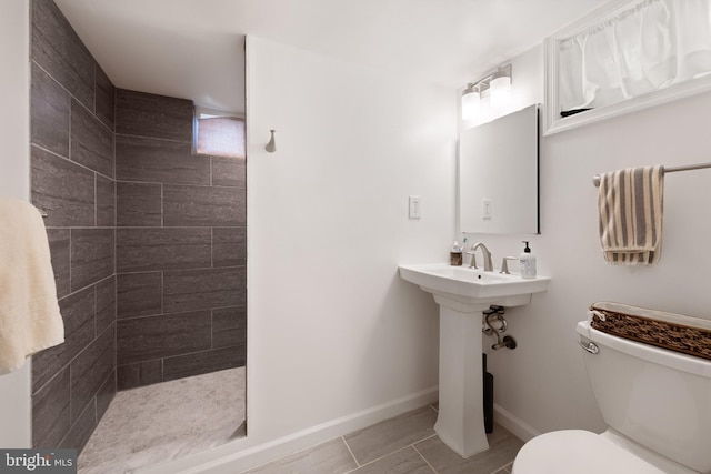11809 Old Drovers Way, Rockville, MD 20852 - full bath with toilet, a tile shower, baseboards, and tile patterned flooring