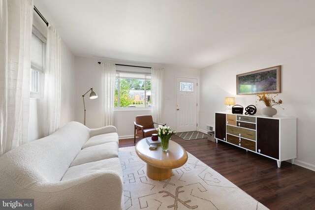 11809 Old Drovers Way, Rockville, MD 20852 - living room featuring dark wood-style flooring and baseboards