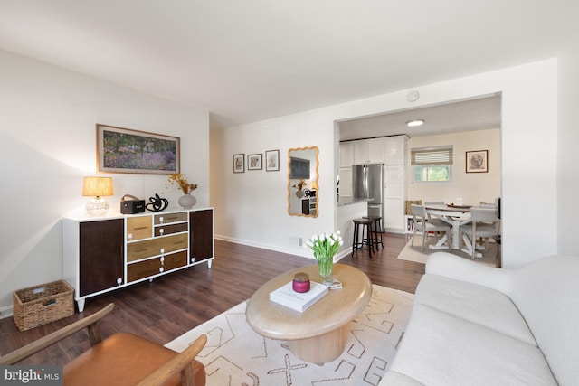 11809 Old Drovers Way, Rockville, MD 20852 - living area featuring dark wood-style floors and baseboards