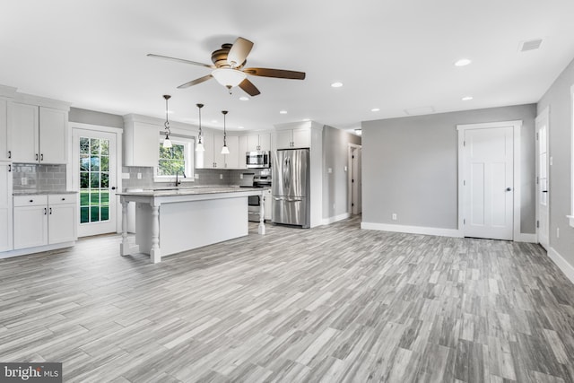 123 Somerset Rd, Stevensville, MD 21666 - kitchen featuring appliances with stainless steel finishes, light countertops, ceiling fan, backsplash, and recessed lighting
