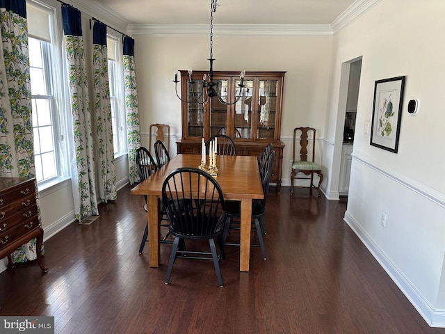 8537 Pine Springs Dr, Severn, MD 21144 - dining area featuring ornamental molding, baseboards, a chandelier, and dark wood finished floors
