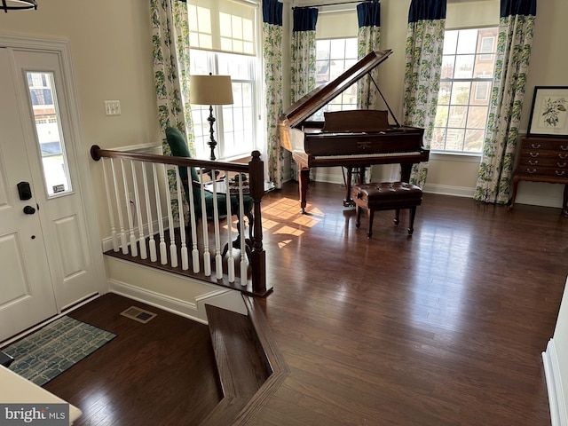 8537 Pine Springs Dr, Severn, MD 21144 - entrance foyer with a wealth of natural light, visible vents, wood finished floors, and baseboards