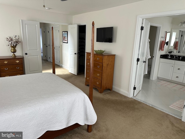 8537 Pine Springs Dr, Severn, MD 21144 - bedroom with light tile patterned flooring, baseboards, and light colored carpet